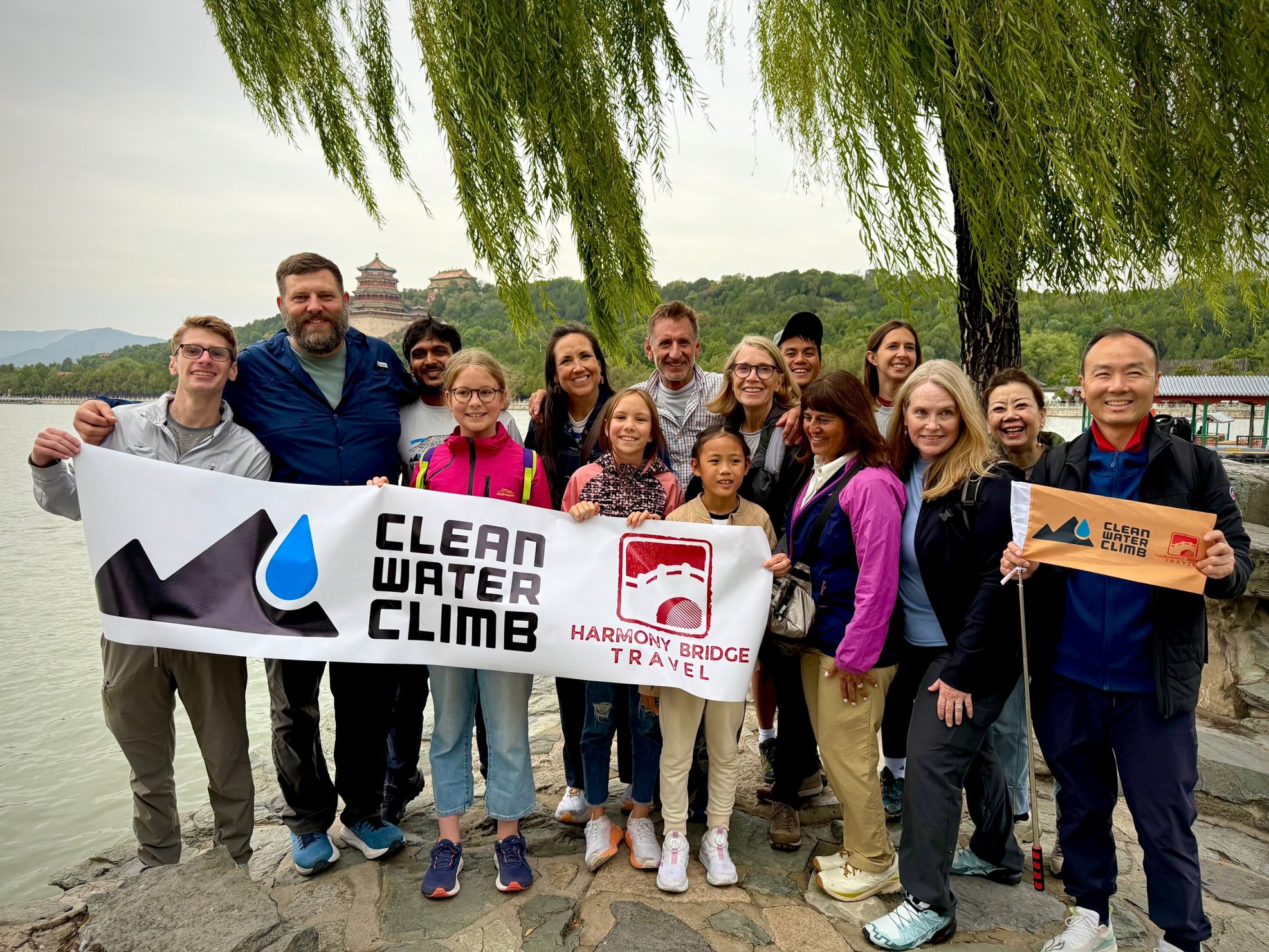 A Clean Water Climb group with their banner at the Summer Palace in Beijing
