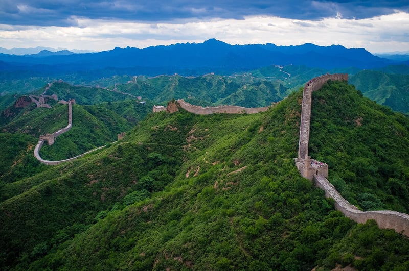 The Great Wall winding over green ridges at Jinshanling