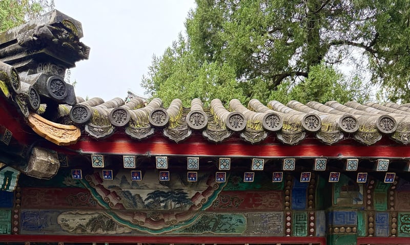Painted eaves and glazed roof tiles at the Summer Palace